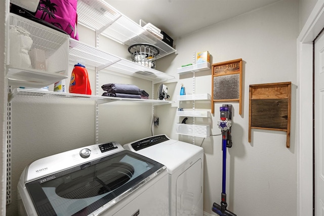 laundry area with separate washer and dryer