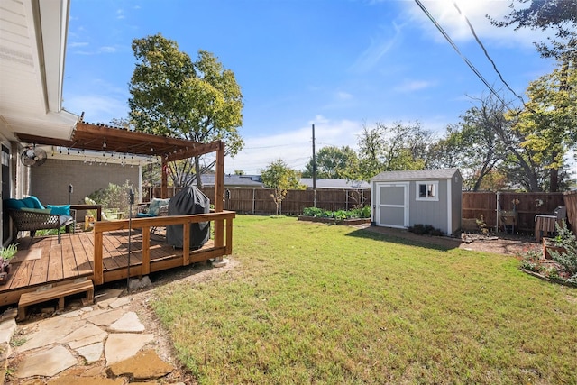 view of yard featuring a wooden deck, a pergola, and a storage unit