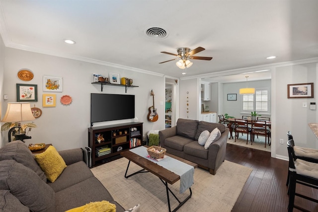 living room with crown molding, ceiling fan, and hardwood / wood-style floors