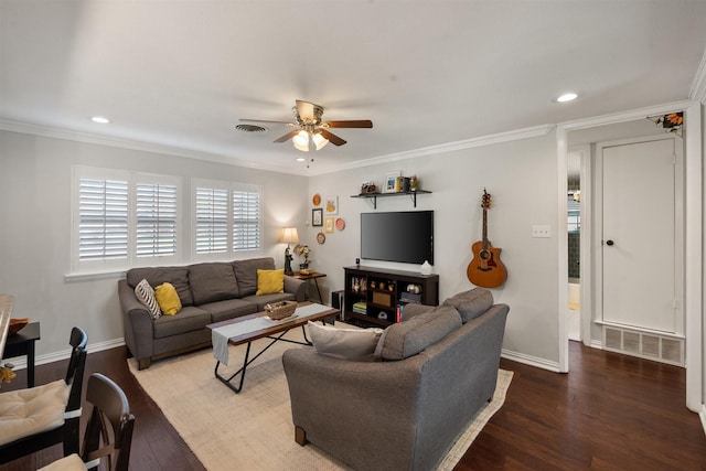 living room featuring ornamental molding, wood-type flooring, and ceiling fan