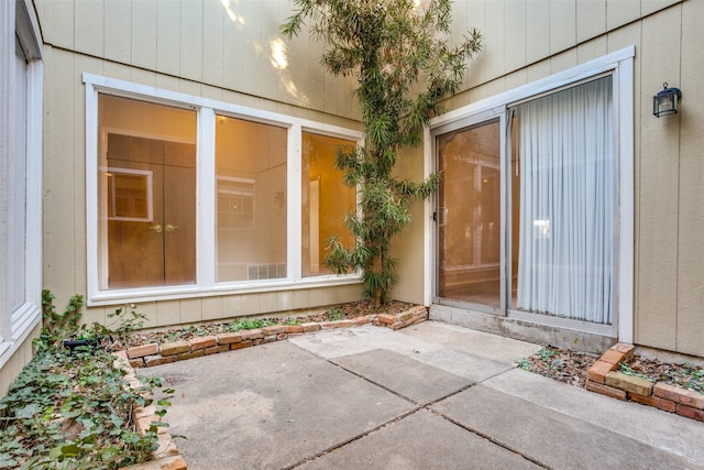 property entrance featuring a patio area