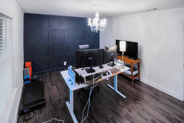 office with a notable chandelier, dark wood-type flooring, and a textured ceiling