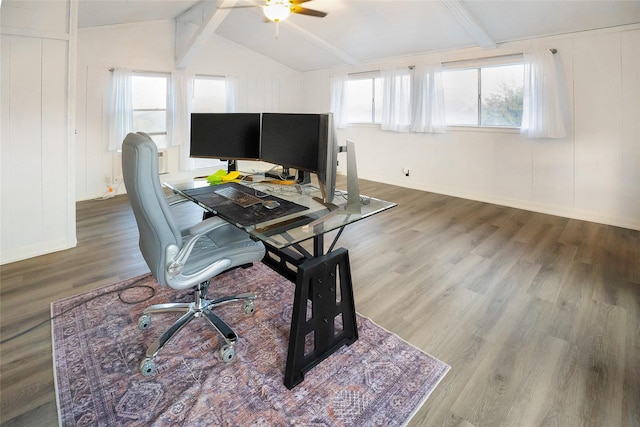 office space with hardwood / wood-style flooring, ceiling fan, vaulted ceiling with beams, and a wealth of natural light