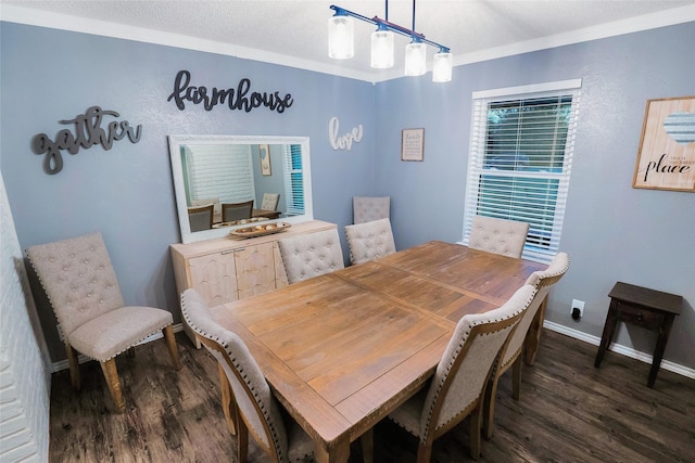 dining area with dark hardwood / wood-style flooring, ornamental molding, and a textured ceiling