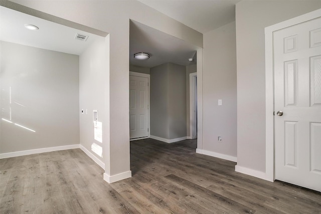 unfurnished room featuring dark hardwood / wood-style flooring