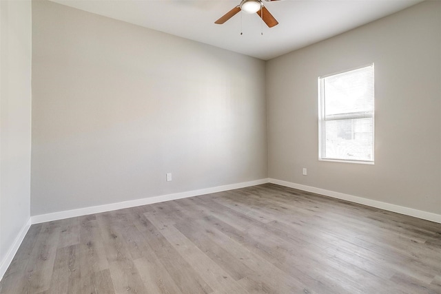 unfurnished room with ceiling fan and light wood-type flooring