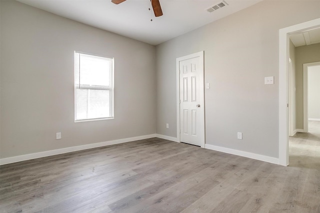 spare room with ceiling fan and light hardwood / wood-style floors