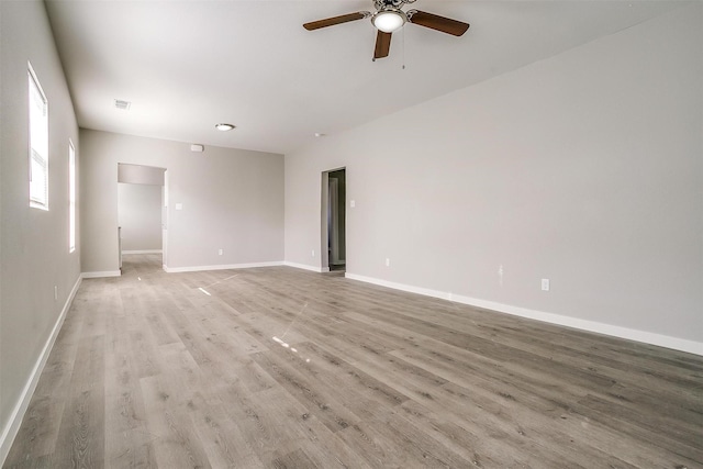 unfurnished room with ceiling fan and light wood-type flooring