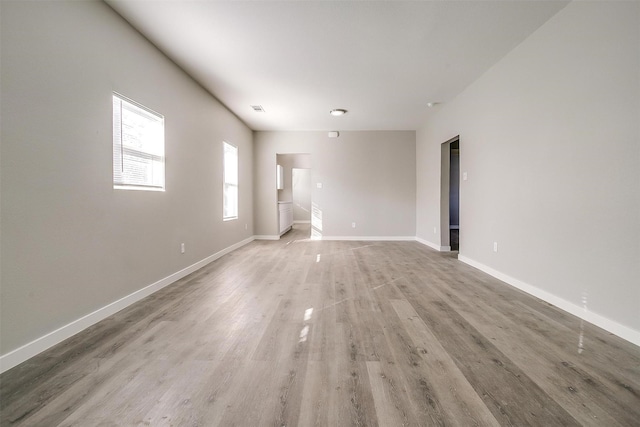 spare room with hardwood / wood-style floors