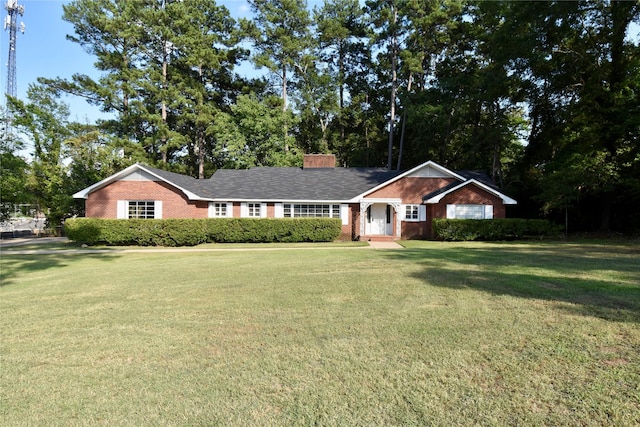 single story home with a front yard