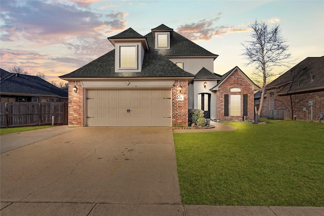 view of front of house with a yard