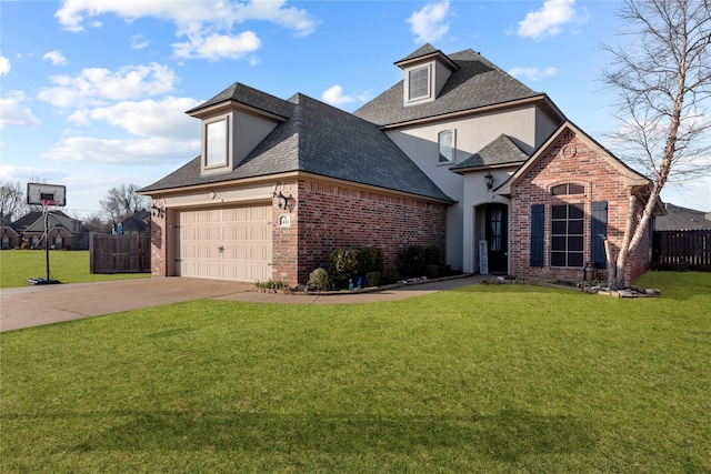 view of front of property with a garage and a front lawn