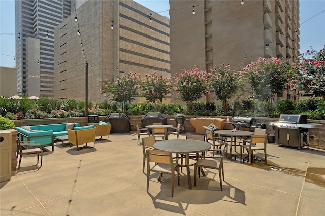 view of patio with area for grilling and an outdoor hangout area