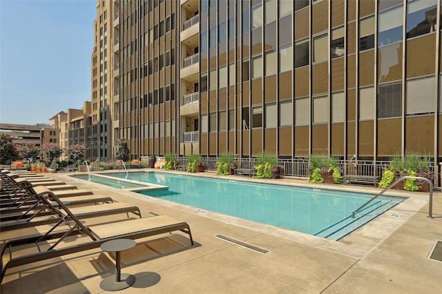 view of swimming pool featuring a patio area