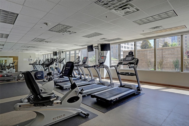 exercise room with a paneled ceiling