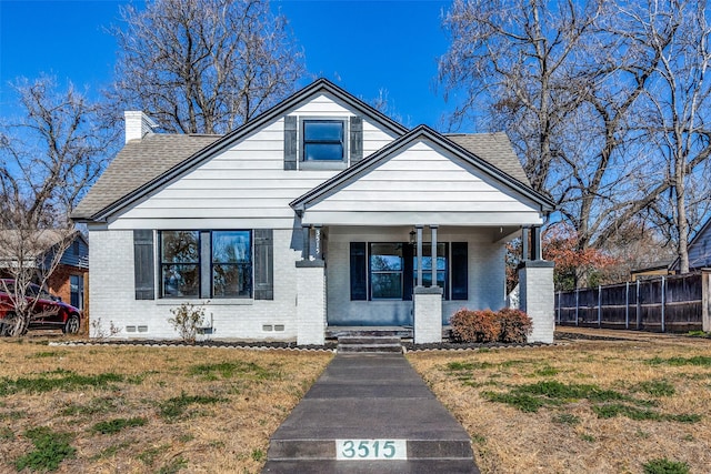 bungalow-style home featuring a front lawn and a porch