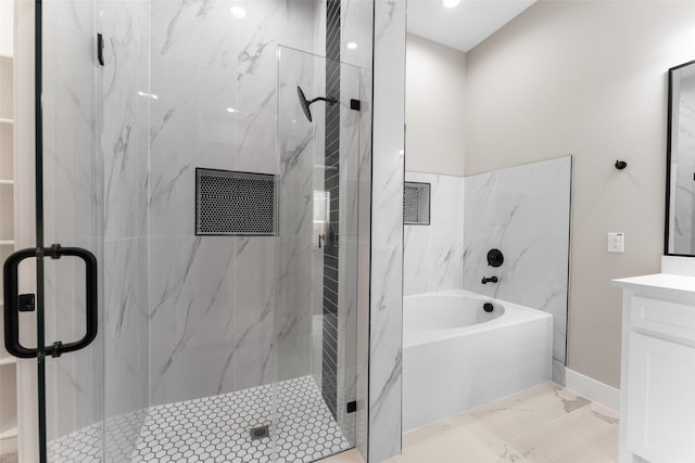 bathroom featuring vanity and shower with separate bathtub