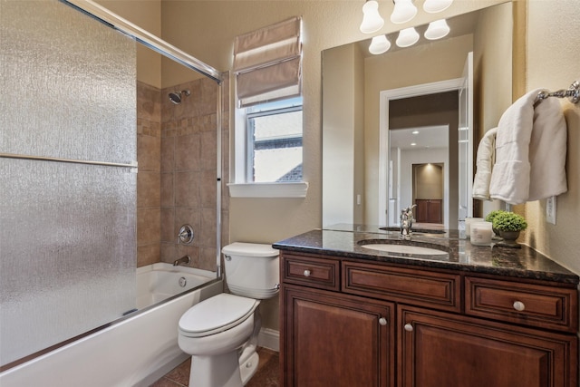 full bathroom featuring bath / shower combo with glass door, vanity, and toilet