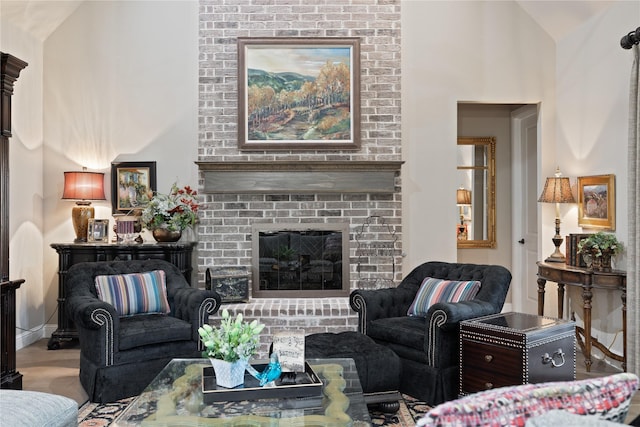 living room with lofted ceiling and a fireplace