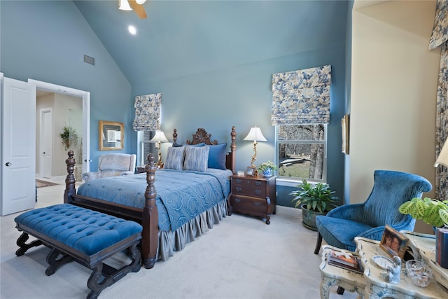 bedroom featuring ceiling fan, light carpet, and high vaulted ceiling