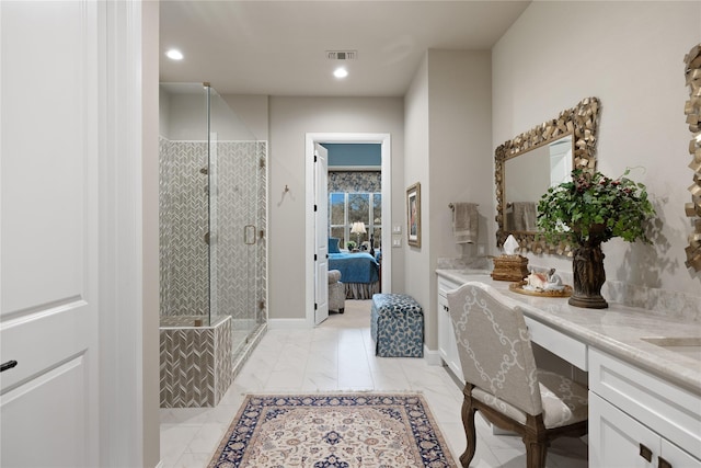 bathroom featuring vanity and walk in shower