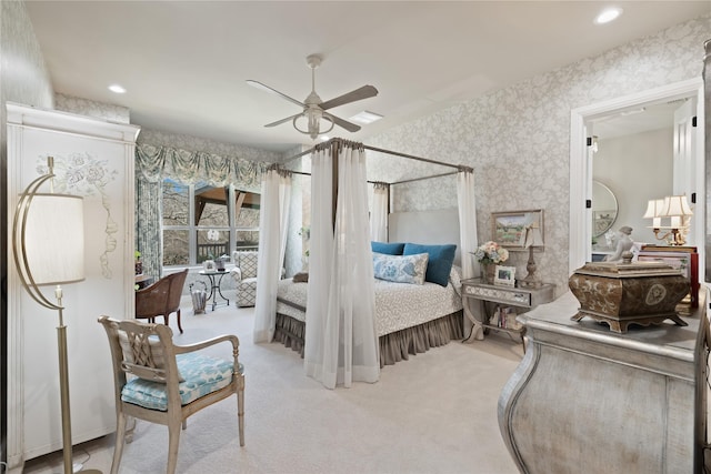 bedroom with ceiling fan and light carpet