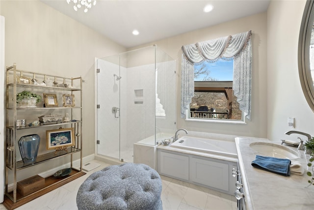 bathroom featuring vanity and independent shower and bath