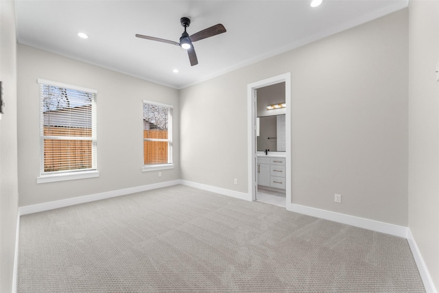 unfurnished bedroom with ceiling fan, ensuite bathroom, recessed lighting, light colored carpet, and baseboards