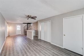 unfurnished living room featuring hardwood / wood-style floors