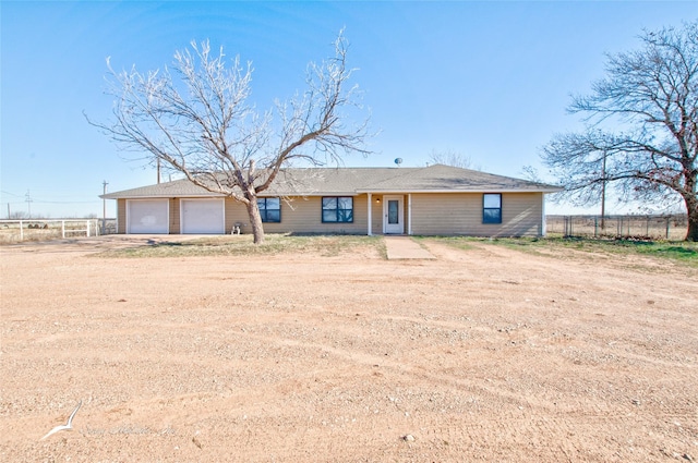 single story home with a garage