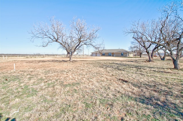 view of yard with a rural view