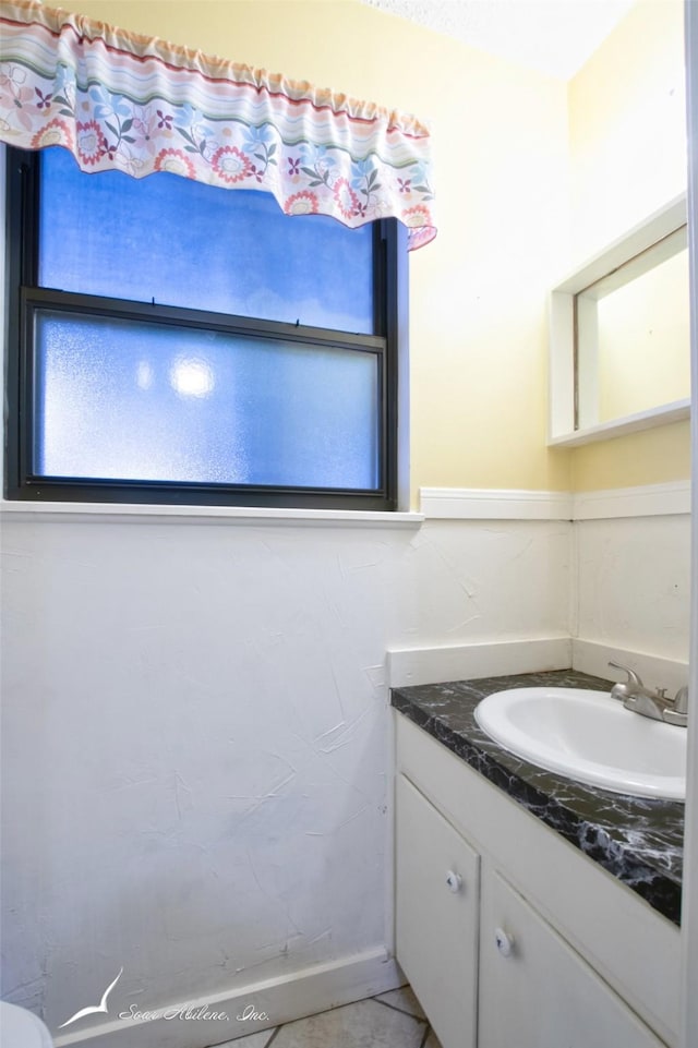 bathroom with vanity and tile patterned floors