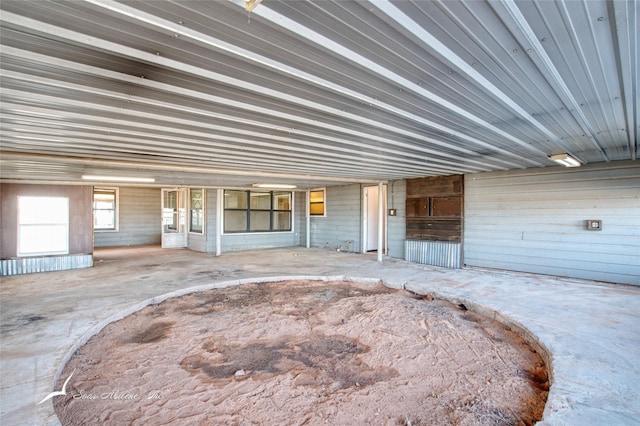 garage featuring wooden walls