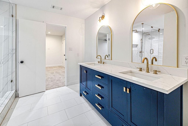 bathroom featuring vanity, tile patterned floors, and a shower with door