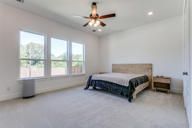 carpeted bedroom featuring ceiling fan