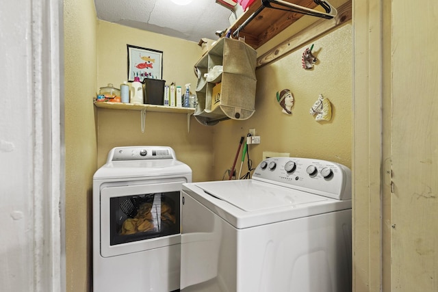 clothes washing area featuring washing machine and dryer