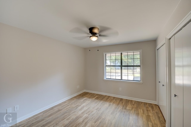 empty room featuring light hardwood / wood-style flooring and ceiling fan