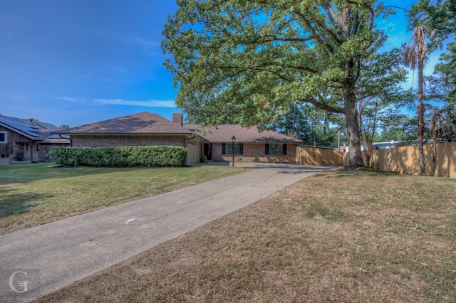 ranch-style home with a front lawn