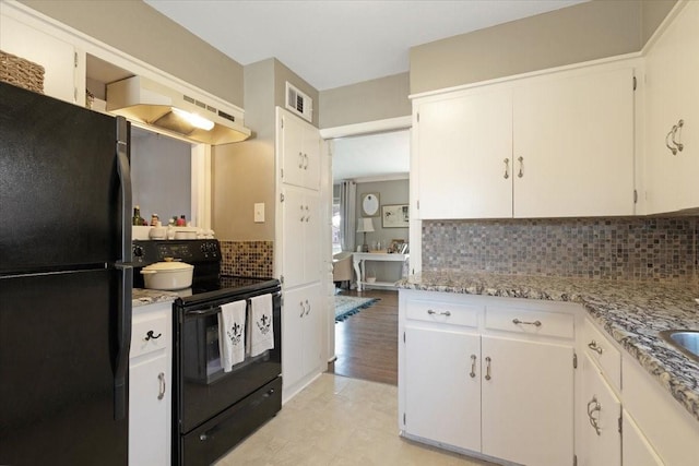 kitchen featuring visible vents, decorative backsplash, under cabinet range hood, black appliances, and white cabinetry