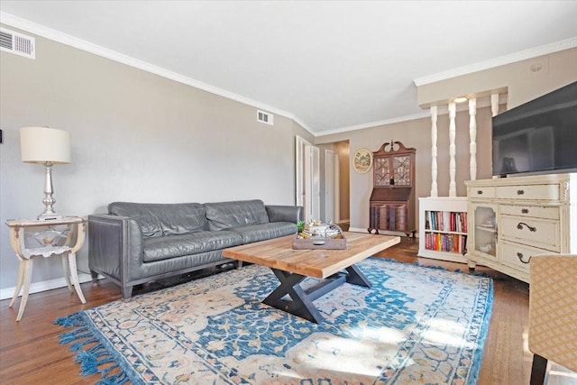 living room featuring crown molding and dark hardwood / wood-style flooring