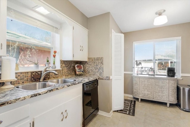 kitchen featuring a wealth of natural light, black dishwasher, sink, and white cabinets