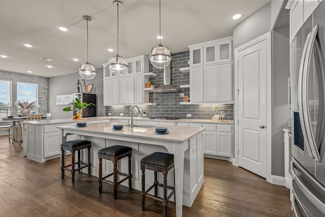 920 Windrock Ln, Prosper, TX 75078 - kitchen with stainless steel fridge, a center island with sink, recessed lighting, dark wood-type flooring, and a sink