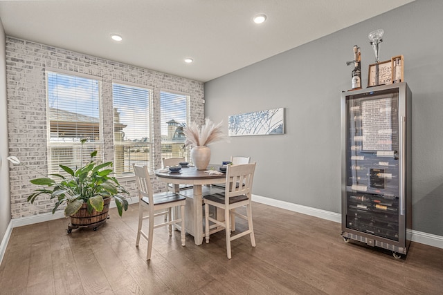 920 Windrock Ln, Prosper, TX 75078 - dining room with baseboards, wood finished floors, beverage cooler, and recessed lighting