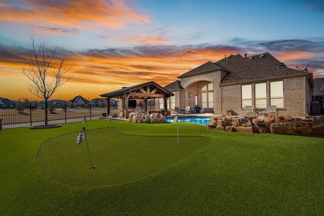 920 Windrock Ln, Prosper, TX 75078 - view of home's community with a gazebo, a putting area, a pool, fence, and a patio area