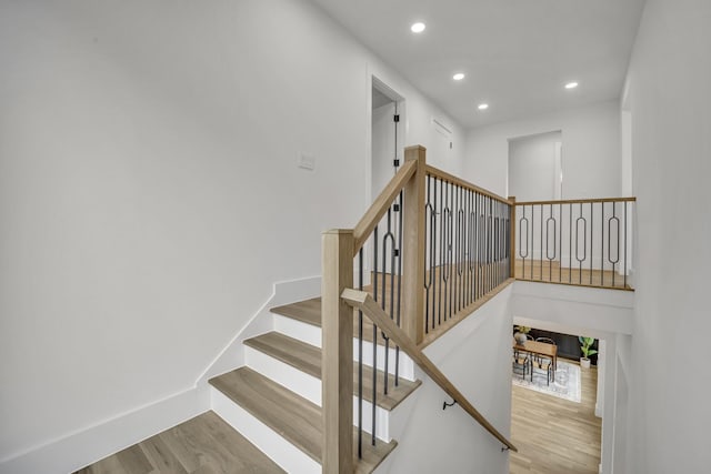 staircase featuring hardwood / wood-style flooring