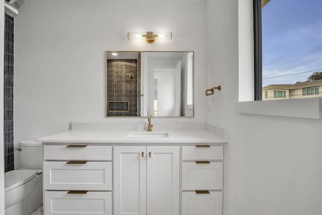 bathroom featuring vanity and toilet