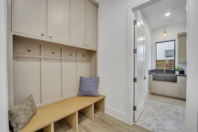 mudroom featuring light hardwood / wood-style floors and sink