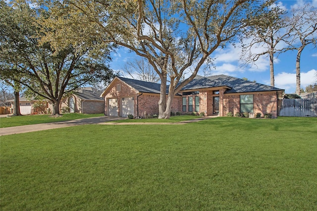 view of front facade with a garage and a front yard