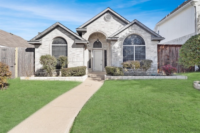 ranch-style house with a front yard