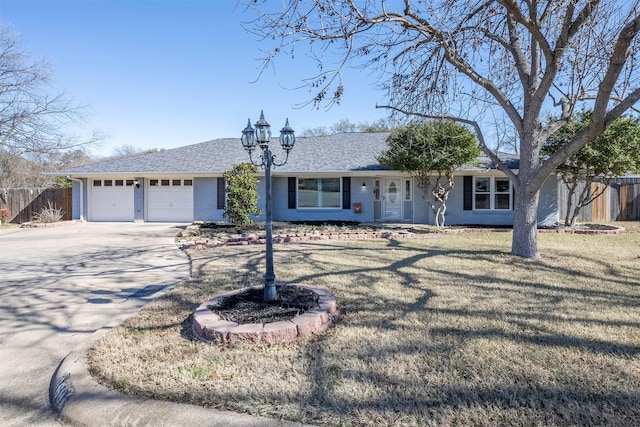 ranch-style home featuring a garage and a front yard